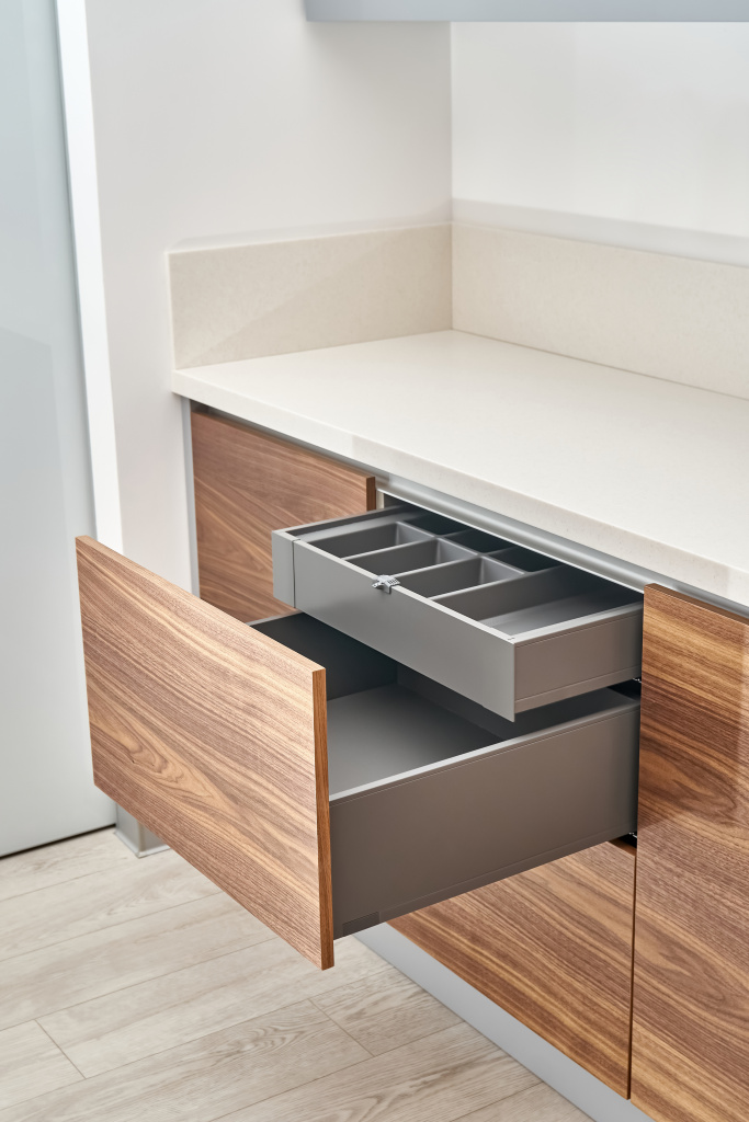 open-drawers-with-cutlery-tray-kitchen-walnut-wood-with-acrylic-solid-surface-countertop.jpg